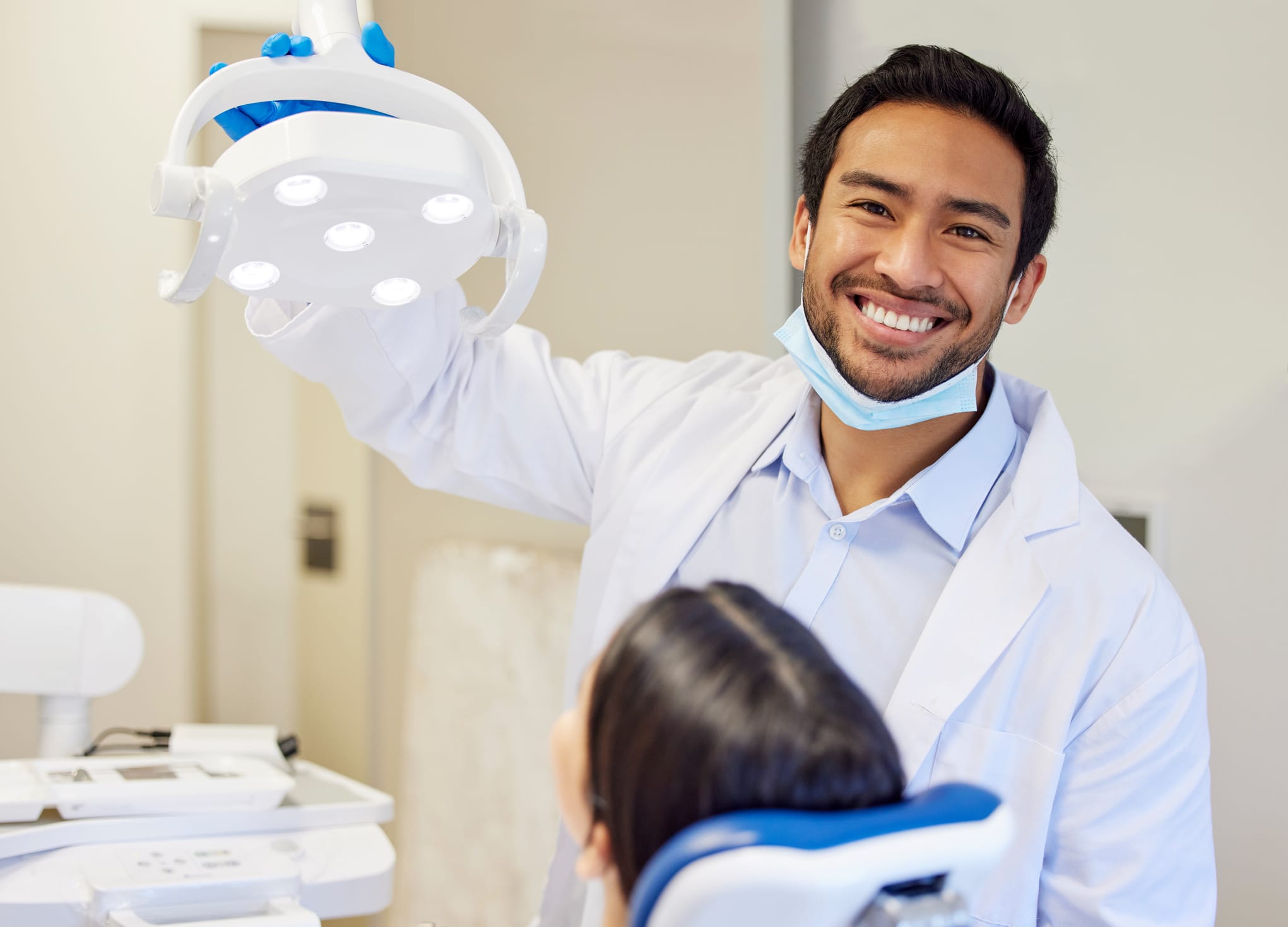 Dentist getting ready to conduct a procedure on his patient