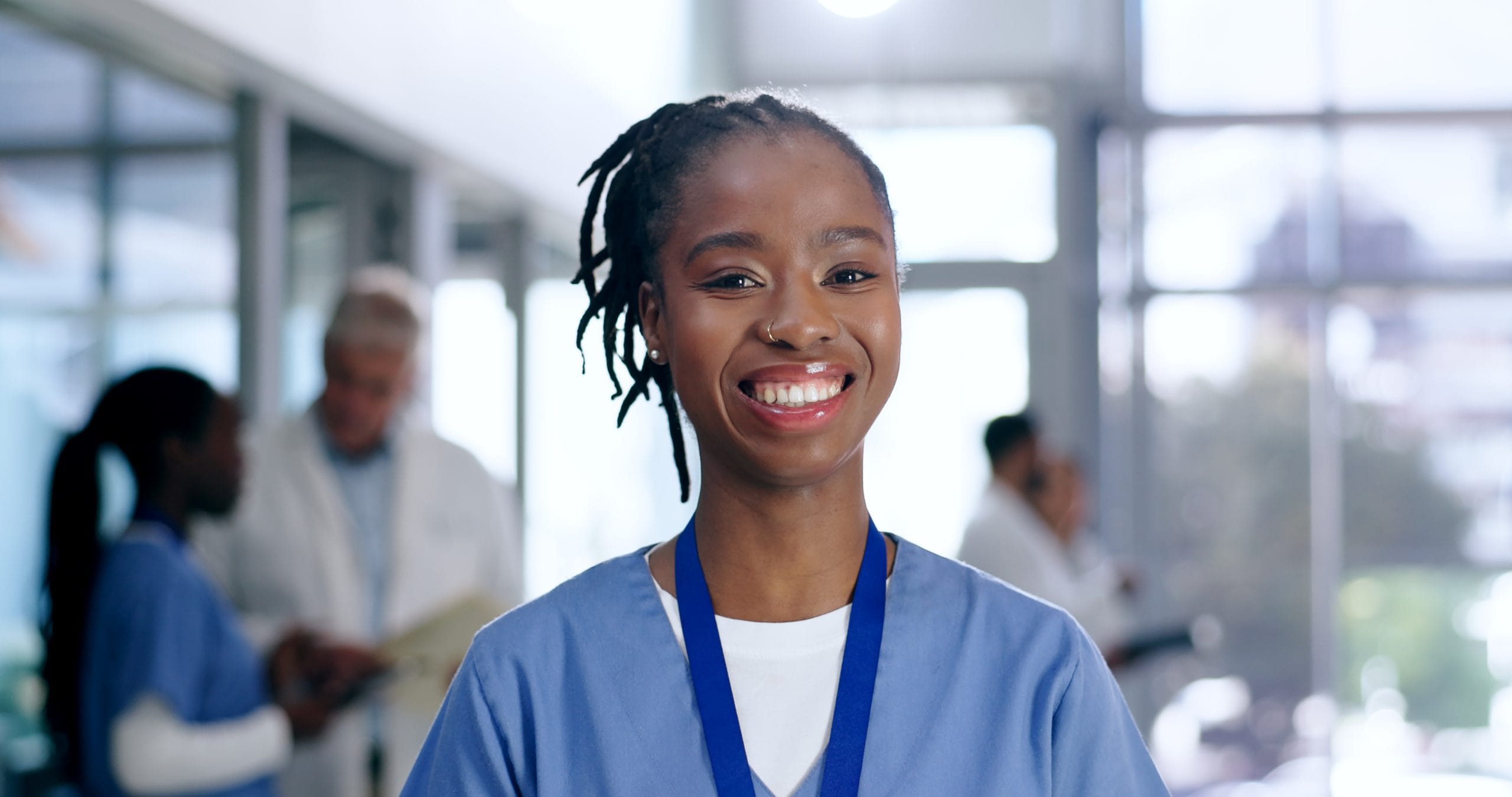 Smiling female dental apprentice